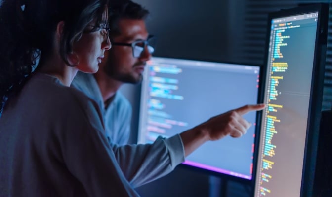 Computer, Female Programmer And Male Training For Coding, Cyber Security Or Software On Computer. Female It Specialist, Male Coder Or Talking To Connect Internet, Information Update And Cloud Computing . Coding Development Concept.